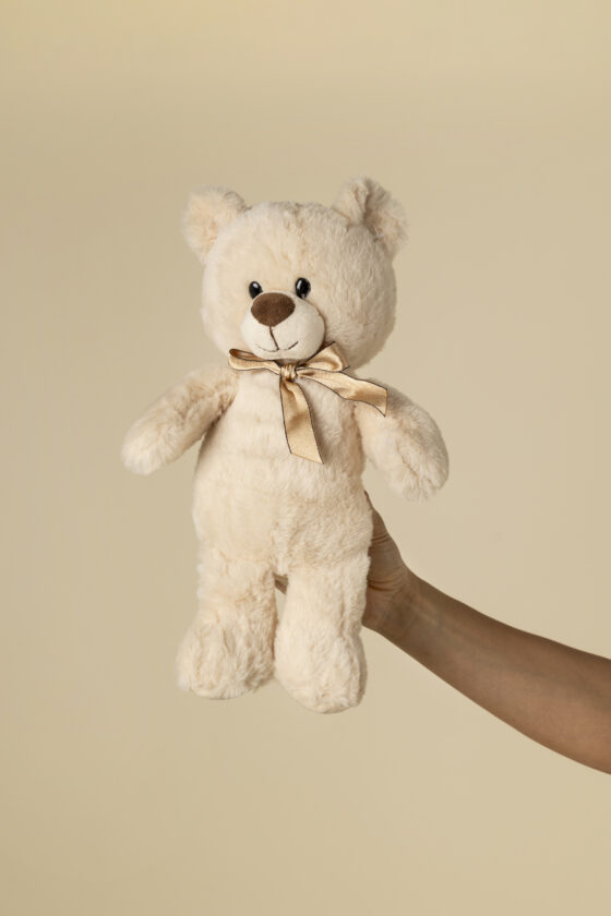 Peluche teddy beige con lazo