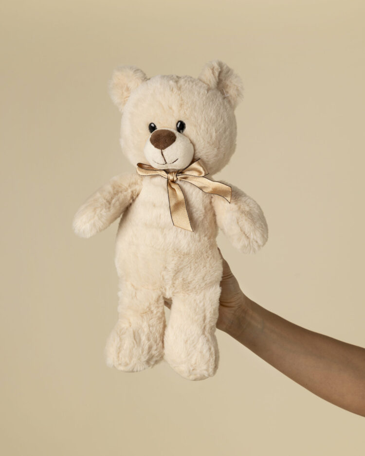 Peluche teddy beige con lazo