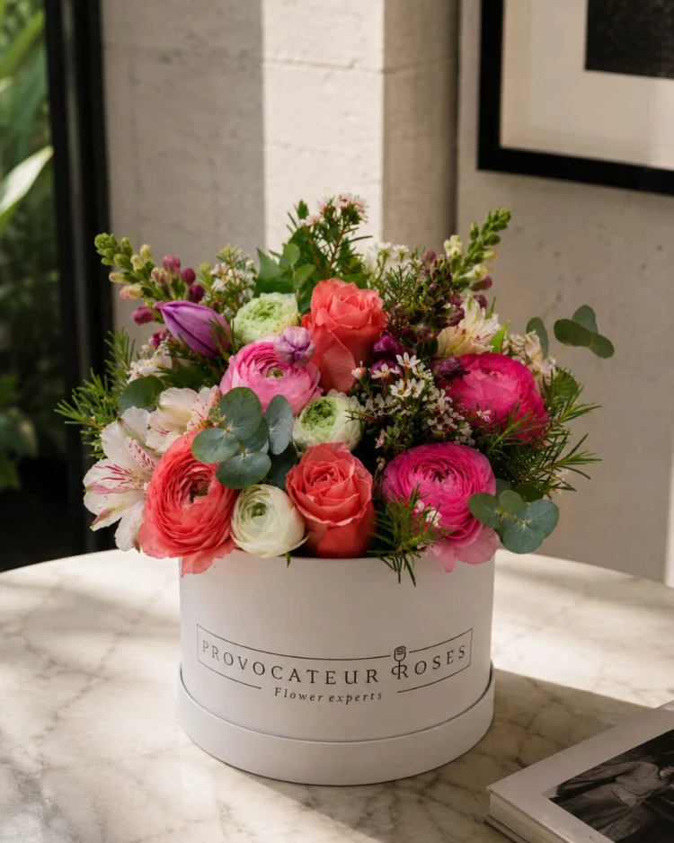 Box of mixed pink flowers
